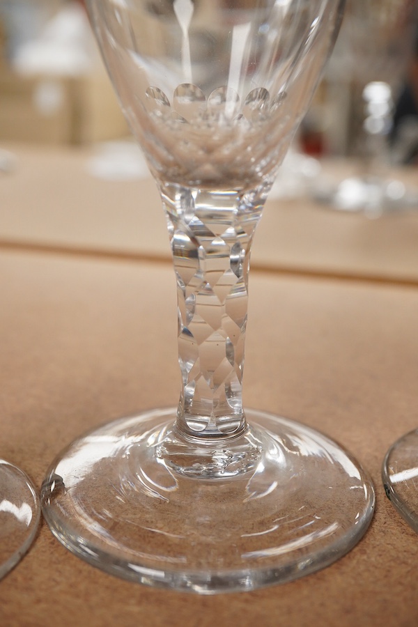 Four Georgian wine glasses, three with engraved bowls, three with faceted stems, and one with an air twist knopped stem and stepped foot, tallest 16cm